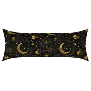 May include: A rectangular body pillow cover featuring a black background with a repeating gold celestial pattern. The design includes golden crescent moons, planets with rings, swirling galaxies, scattered stars, and clouds across the fabric.