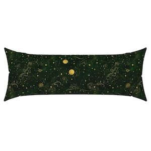 May include: A long, rectangular body pillow with a dark green background and a celestial design. The pattern includes gold-colored planets, stars, and swirling lines. The pillow has a soft, plush appearance.