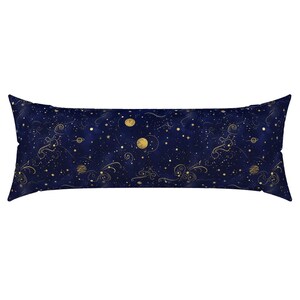 May include: A long, rectangular body pillow with a dark blue background and a celestial design. The pattern features gold-colored planets, stars, and swirling lines. The pillow is designed for comfort and support.