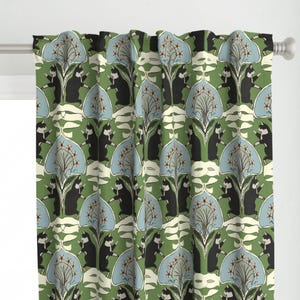 May include: Green curtain featuring a repeating pattern of black cat silhouettes, light blue floral shapes, and cream-coloured leaf-like designs. The curtain hangs on a white rod and has a pleated texture.