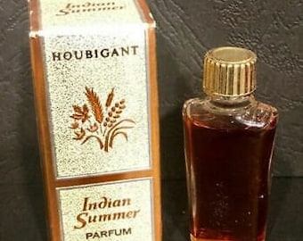 May include: A brown box with gold lettering and a small bottle of perfume. The box says "Houbigant Indian Summer Parfum 3cc".