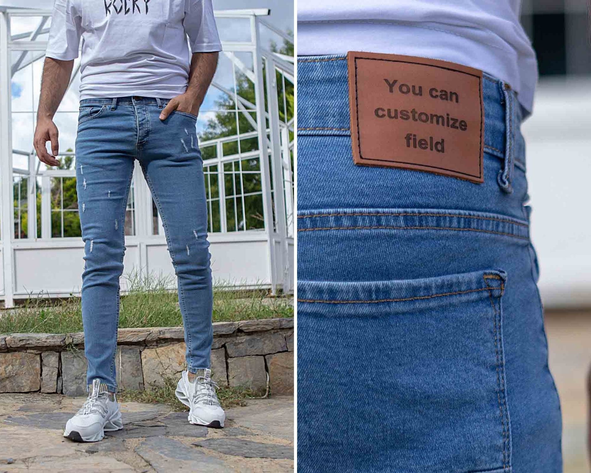 Custom design of blue denim jeans with ripped knees and patches on Craiyon