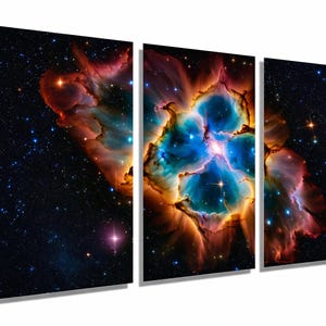 May include: A triptych canvas print depicting a vibrant nebula in space. The artwork features a central panel with a bright blue and orange core, flanked by panels showing star-filled dark space and colorful nebula clouds.