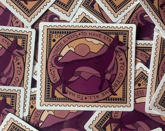 May include: A sticker with a purple dog silhouette and the text "Kindness Always + To Have Strength + To Overcome All + To Have Strength" in a vintage stamp design.
