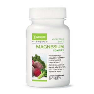 May include: White bottle with a green label that says "Neolife Nutritionals Whole Food Based Magnesium Complex". The bottle has a green leaf logo and a picture of red beet, broccoli, and kale. The label also says "Promotes energy production, heart health, muscle function & balanced mood*" and "Dietary Supplement 60 Tablets".