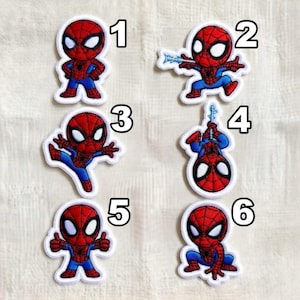 May include: Set of six Spider-Man patches. Each patch features a different pose of the superhero in his classic red and blue suit. The patches have a white border and are numbered 1 through 6.