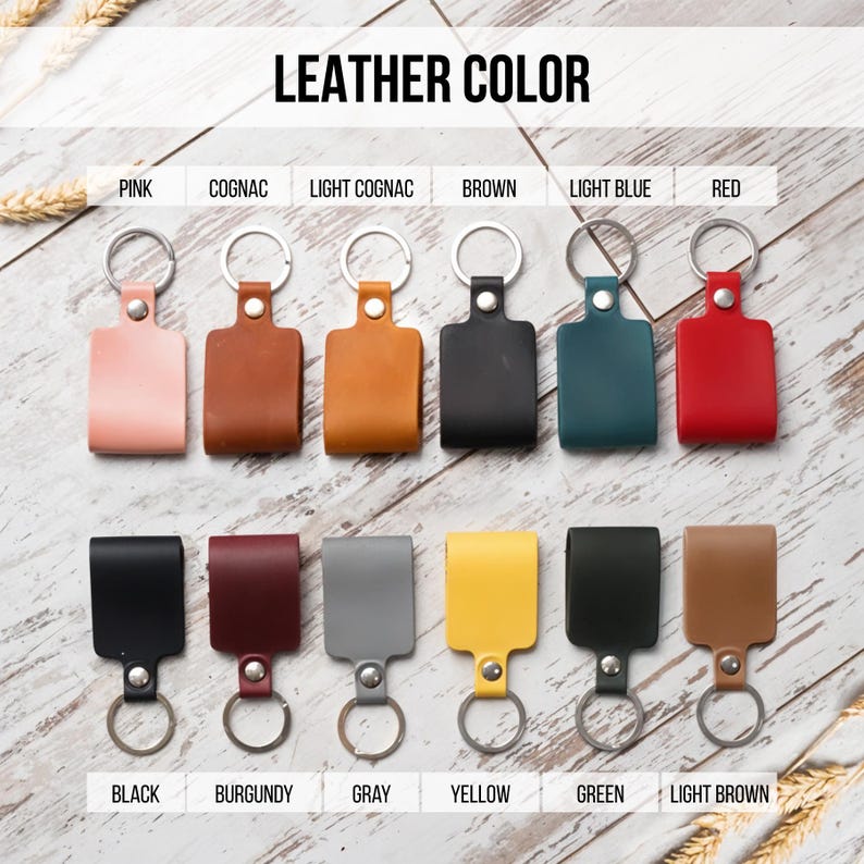 May include: Keychains in various colors, including pink, cognac, light cognac, brown, light blue, red, black, burgundy, gray, yellow, green, and light brown. The keychains are made of leather and have a metal ring.