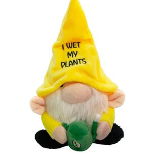 May include: A yellow plush gnome wearing a yellow hat with the text "I WET MY PLANTS". The gnome is holding a green watering can.