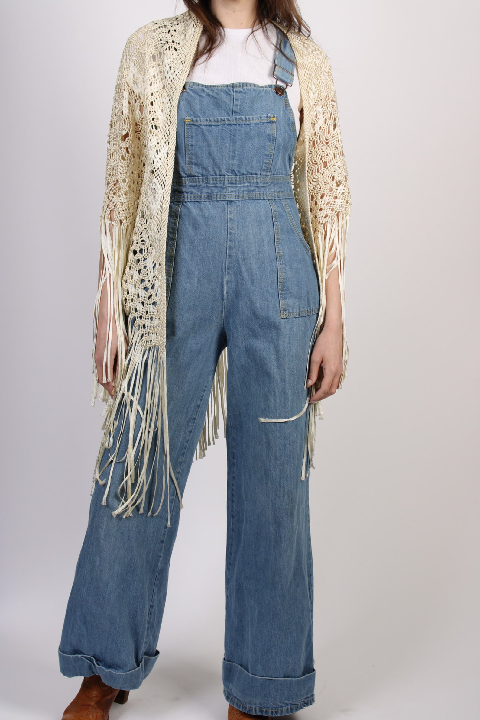 These Vintage wide-leg denim dungarees in mid-wash blue are a perfect spring-friendly jeans alternative.