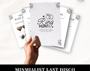 Puede incluir: Un conjunto de tarjetas de juego impresas en blanco para despedidas de soltera con texto negro y gráficos de bolas de discoteca. La tarjeta central muestra el título Ring Hunt con un icono de anillo e instrucciones. Otras tarjetas muestran juegos.