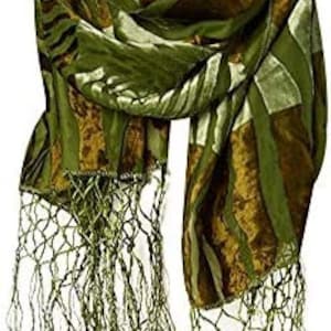 May include: A green and gold silk scarf with a geometric pattern and fringe tassels.