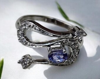 Oval Tanzanite Ring: Solid Silver with Zircon Accents