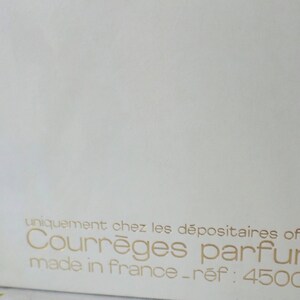 May include: White box with gold lettering that reads "uniquement chez les d&eacute;positaires officiels Courr&egrave;ges parfums made in france - ref: 4500 04"