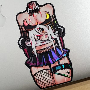 May include: A sticker featuring a colorful illustration of a woman with a detached head, wearing a black and white outfit with a bow tie and fishnet stockings. The sticker has a holographic finish.