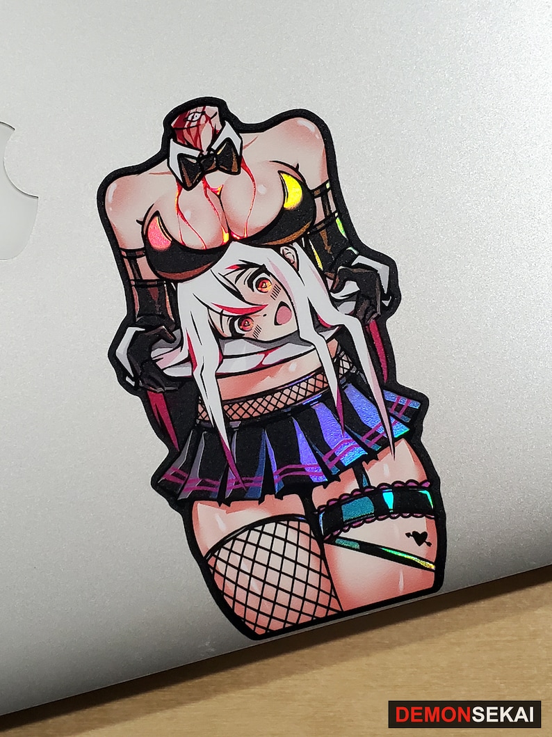 May include: A sticker featuring a colorful illustration of a woman with a detached head, wearing a black and white outfit with a bow tie and fishnet stockings. The sticker has a holographic finish.