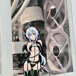 May include: A white computer case with a clear side panel showing a white and black computer fan. A sticker of an anime character with white hair, black horns, and a black and green outfit is on the side panel.