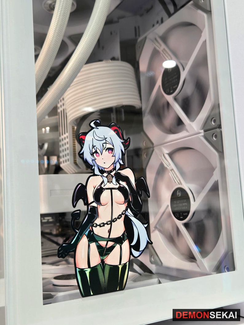 May include: A white computer case with a clear side panel showing a white and black computer fan. A sticker of an anime character with white hair, black horns, and a black and green outfit is on the side panel.