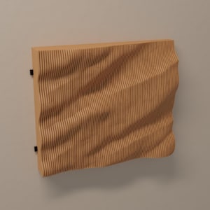 May include: A brown wood wall panel with a wavy, textured surface. The panel is mounted on a wall with black metal brackets.