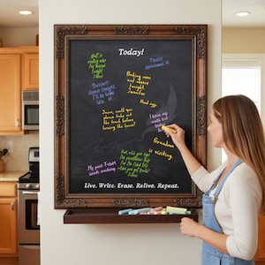 May include: A rectangular chalkboard with an ornate dark brown wooden frame and a matching chalk tray. The board features the text "Today!" at the top and "Live. Write. Erase. Relive. Repeat." at the bottom, with various handwritten notes.