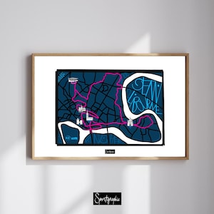 Op de afbeelding: Een ingelijste print met een stadsplattegrond met een roze route, witte bezienswaardigheden en de tekst "SEAN BOURNE" in blauw. De kaart staat tegen een donkerblauwe achtergrond met zwarte lijnen. De print zit in een houten lijst.