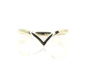 May include: A gold-toned V-shaped ring, designed to be worn as a wedding band or promise ring.