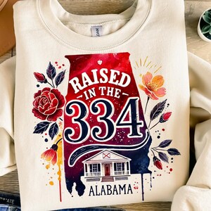 Raised in the 334 PNG – Alabama Sublimation Design with Area Code, State Shape, Floral Accents and Southern Porch Art for Shirts or Gifts