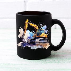 May include: Black ceramic mug with a watercolour illustration of a yellow and black excavator. The design includes blue, white, and brown paint splatters. The mug has a black handle and a dark interior.