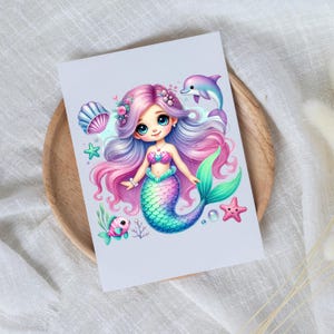 May include: A whimsical illustration of a mermaid with flowing pink and purple hair, a colorful tail, and a seashell bra. A purple dolphin, starfish, and other sea creatures surround the mermaid. The artwork is on a white card.