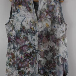 May include: A white ceramic mug with a black handle and the text "But First, Coffee" in a handwritten style. The mug is likely for hot beverages and has a glossy finish.