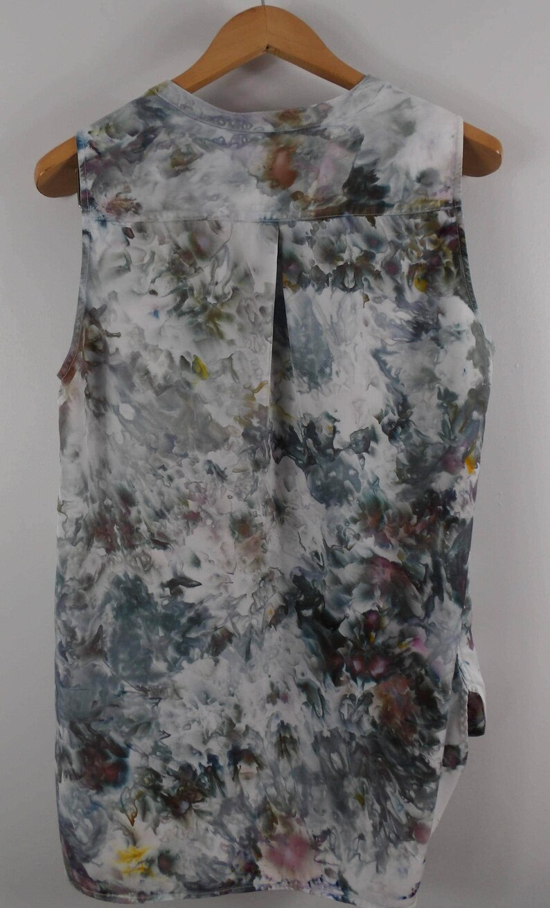 May include: A white ceramic mug with a black handle and the text "But First, Coffee" in a handwritten style. The mug is on a white surface. The mug is 4 inches tall.