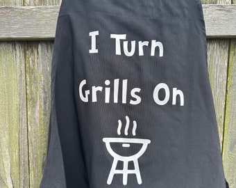 I turn grills on men’s black apron