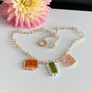 Necklace is embellished with handmade pastel velvet charms. 3 charms made of orange, green and cream velvet.