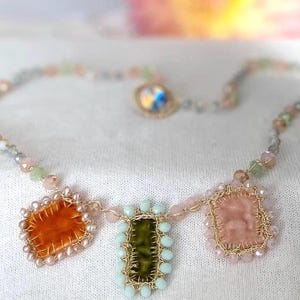3 handmade charms add uniqueness and exclusivity to the necklace. 3 charms made of orange, green and cream velvet.