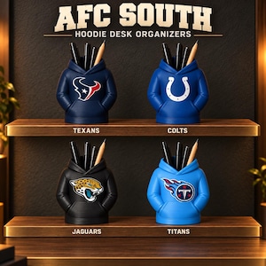 May include: Four hoodie-shaped desk organizers representing AFC South teams. The navy Texans, blue Colts, black Jaguars, and light blue Titans organizers each hold pens and pencils. The text AFC SOUTH HOODIE DESK ORGANIZERS is displayed above.
