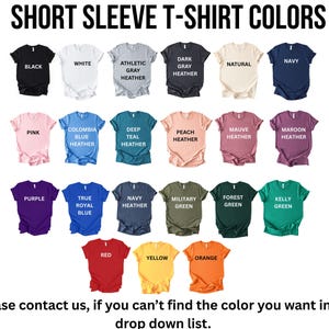 a collection of short sleeve t-shirt colors, including black, white, gray, natural, navy, pink, blue, deep blue, peach, mauve, maroon, true blue, purple, navy blue, forest green, green, yellow, red, orange, and yellow.