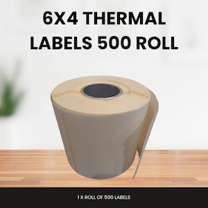 May include: A roll of 6x4 inch thermal labels with the text "6X4 THERMAL LABELS 500 ROLL". The roll is beige and has a dark grey core. The text "1 X ROLL OF 500 LABELS" is at the bottom.