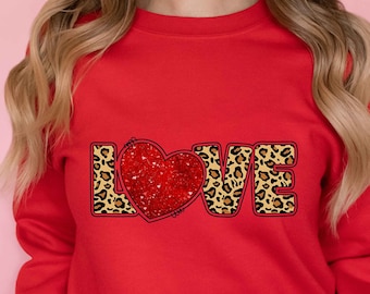 May include: Red sweatshirt with a leopard print "LOVE" graphic featuring a red glitter heart.
