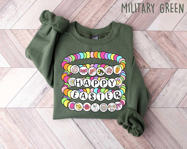 May include: A green sweatshirt with a colorful beaded design that says "Happy Easter".