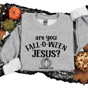 May include: Gray sweatshirt with the text "Are you Fall-O-Ween Jesus?" and a small pumpkin graphic with the text "Matthew 4:19".