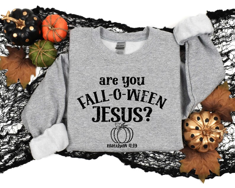 May include: Gray sweatshirt with the text "Are you Fall-O-Ween Jesus?" and a small pumpkin graphic with the text "Matthew 4:19".