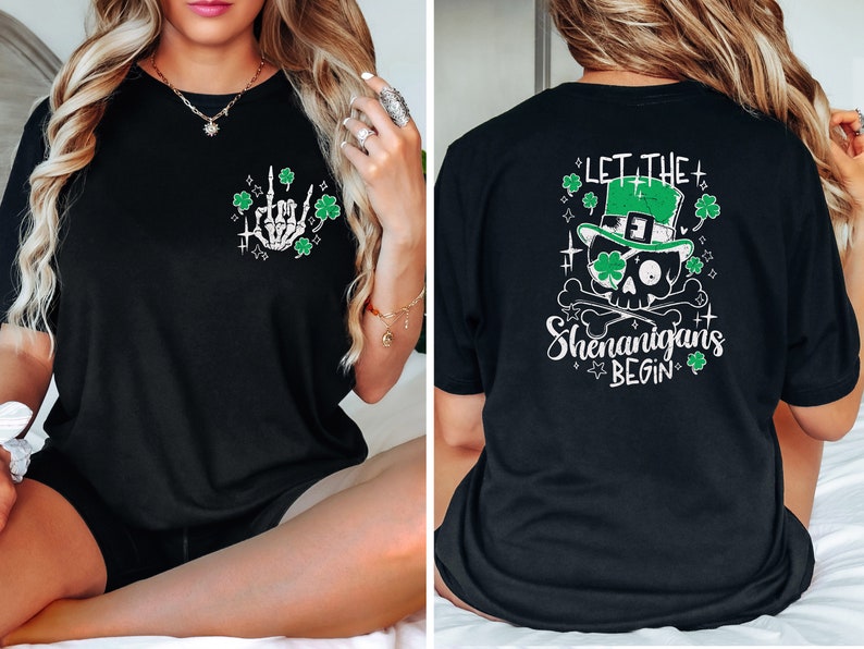 May include: Black t-shirt with a green shamrock and skeleton hand graphic on the front and a green skull wearing a leprechaun hat with the text "Let the Shenanigans Begin" on the back.