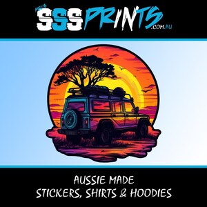 May include: A colourful illustration of a vintage off-road vehicle driving through a sunset landscape. The vehicle has a roof rack and is driving on a dirt road. The background is a sunset with a bright orange sun and a blue sky. The text "SSS PRINTS .COM.AU" is at the top of the image. The text "AUSSIE MADE STICKERS, SHIRTS & HOODIES" is at the bottom of the image.