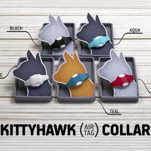 May include: Five different colored cat silhouettes with a small round device attached to their necks. The devices are labeled with the colors: white, black, aqua, teal, and red. The text "KITTYHAWK (AIR TAG) COLLAR" is below the silhouettes.