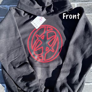 May include: Black hooded sweatshirt with a red graphic design on the front. The design is a circular shape with a stylized symbol inside. The word "Front" is printed in white on the upper right side of the sweatshirt.