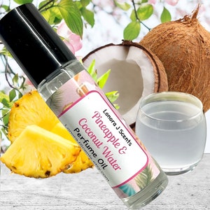 May include: A clear glass perfume oil bottle with a black cap, labeled "Pineapple & Coconut Water." The image includes a pineapple slice, a coconut, and a glass of coconut water, suggesting a tropical fragrance.