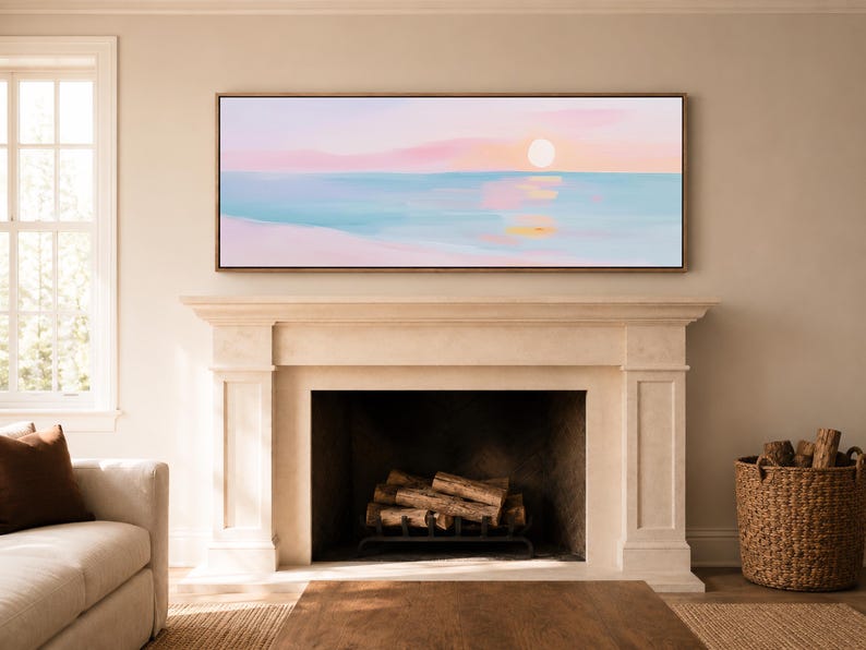 May include: A panoramic rectangular wall art piece featuring an abstract seascape painting with a soft pastel color palette. The artwork displays a pale pink sky, a bright white sun, and calm blue water with gentle reflections in shades of pink and gold.