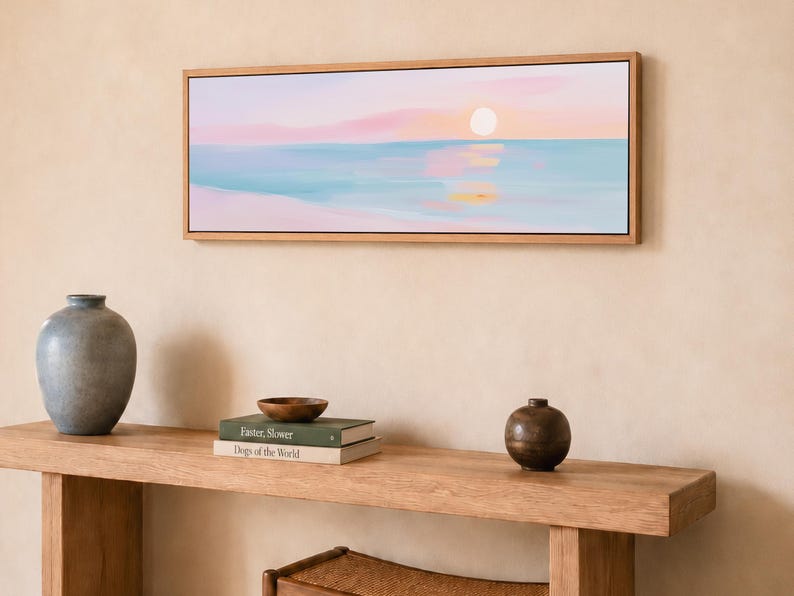 Soft pastel ocean wall art with a simple sunset horizon, formatted as a black framed canvas print for serene bedrooms, living rooms, and coastal interiors.