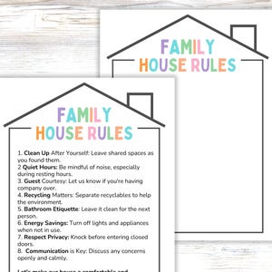 May include: Two white rectangular signs with a black house outline and chimney. The text FAMILY HOUSE RULES appears in pastel colors. One sign lists eight numbered rules including Clean Up, Quiet Hours, Guest Courtesy, and Energy Savings.