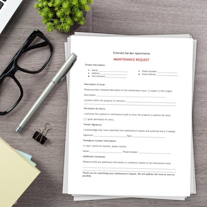 May include: A white maintenance request form for Emerald Garden Apartments with black text and a red header. The document includes fields for tenant information, issue description, entry permission, signature, and emergency contact details.