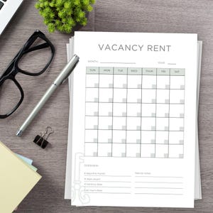 Printed Page on a desk. Example of one of the pages in the Rental Property Planner Bundle - Vacancy Rent Calendar Tracker Page